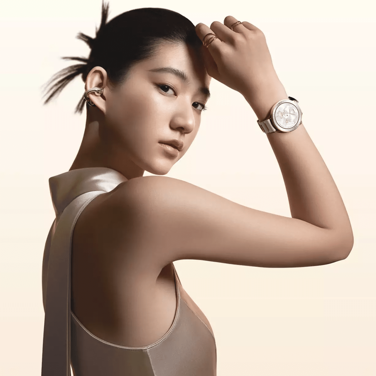 Woman wearing the Oppo Watch X3 Mini smartwatch in a premium lifestyle setting