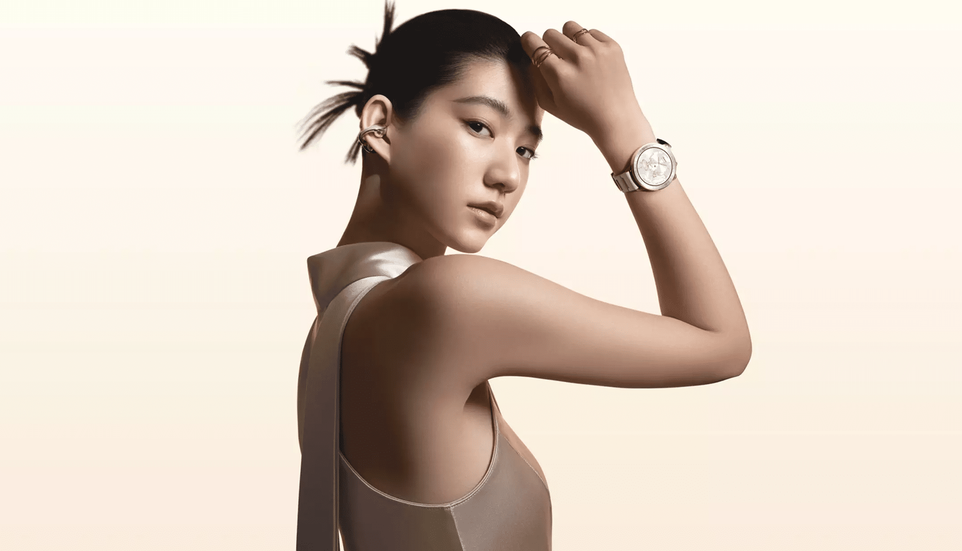 Woman wearing the Oppo Watch X3 Mini smartwatch in a premium lifestyle setting